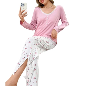 Women's pink lace trim pajama set with floral long pants and stylish side slits