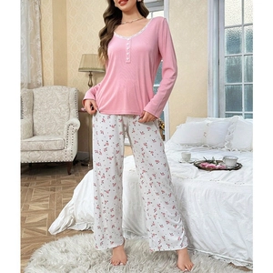 Pink V-neck lace pajama set with long sleeve ribbed top and floral print pants