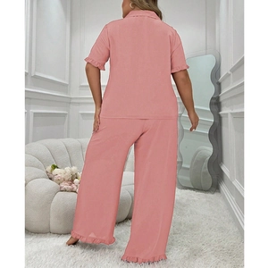 Pink two-piece women's pajama set featuring short sleeve lapel top and ruffled long pants
