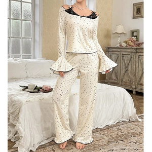 Elegant two-piece lace pajama set with black polka dots and flared sleeves