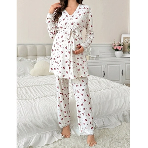 Floral maternity sleepwear set with wrap top, matching pants, and delicate lace trim
