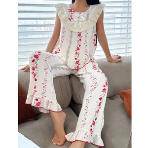 Women's floral pajama set with sleeveless top and pants featuring lace ruffle details