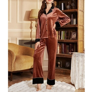 Women's V-neck velvet pajama set with contrast trim and long sleeves in rust red