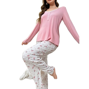 Women's V-neck pajama set with lace trim top and pink floral print trousers