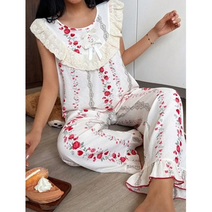 Women's pajama set featuring red rose prints with lace trim and bow details