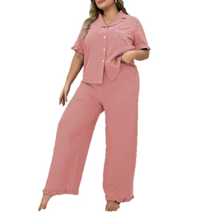 Women's plus size two-piece pajama set with short sleeve button-up shirt and wide-leg pants