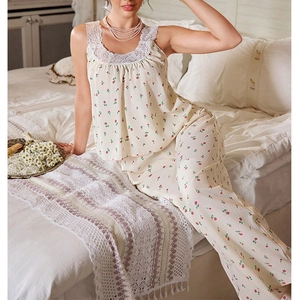 Close-up of sweet floral print pajama set featuring delicate lace straps and soft fabric