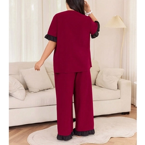 Women's burgundy V-neck pajama set with short sleeves and black ruffled hem detailing