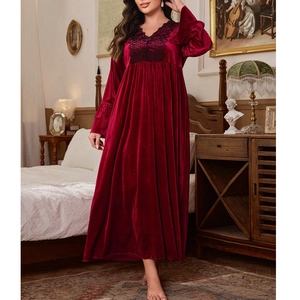 Close-up of elegant V-neckline with black floral lace on burgundy velvet nightdress