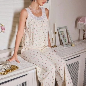 Floral pajama set detail with white lace neckline trim on sleeveless top and pink print