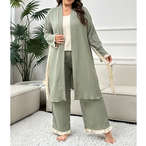Detailed view of sage green three-piece pajama set with ruffled edges and waffle texture