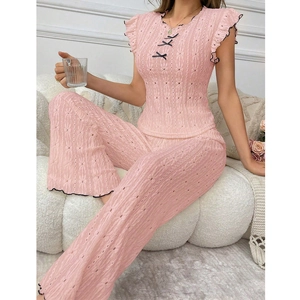 Pink pointelle pajamas set with bow tie and ruffle trim for a sweet loungewear style