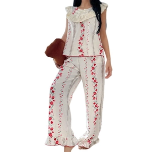 Women's floral pajama set with sleeveless lace top and floral pants for home lounging