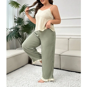 Three-piece pajama set with spaghetti strap top and sage green wide-leg trousers