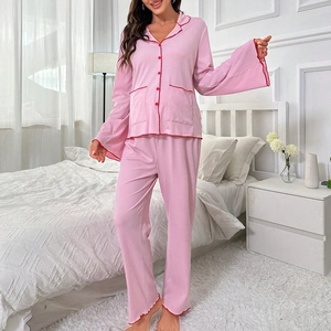 Pink long-sleeved pajamas set with red trim piping and V-neck button-down shirt