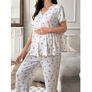 Detail of floral maternity loungewear featuring pink ruffle trim and V-neckline design