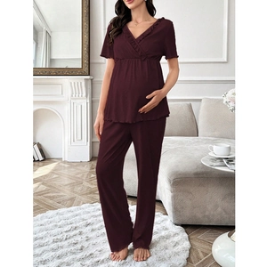 Detail of burgundy maternity loungewear set with V-neck lace trim and elastic waistband