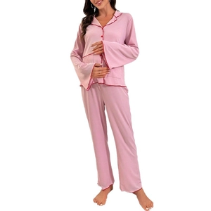Pink women's maternity pajama set with long sleeves and contrasting red trim details