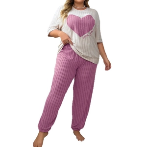 Women's plus size pajama set with white heart print top and pink ribbed lounge pants