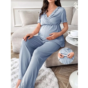 Detail of adjustable waist buckle on blue ribbed maternity pajama pants for a custom fit