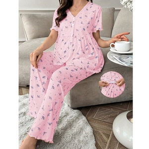 Detail of floral loungewear showing ribbed fabric texture and wavy lettuce edge cuffs