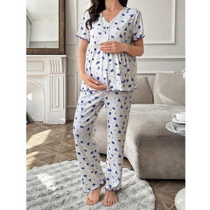 Detail of floral maternity pajamas with V-neck, blue ruffled edges, and high waist design