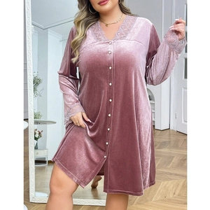 Detail of pink velvet sleepwear dress featuring lace trim and pearl button closure