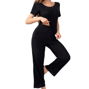 Women's backless black ribbed knit pajama set with short sleeve top and wide leg pants