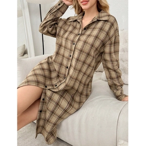 Detailed view of women's long sleeve plaid nightshirt with classic collar and buttons