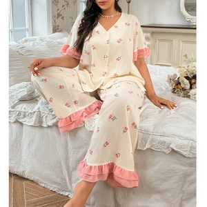 Detail of pink tulip floral print and chiffon ruffle hem on soft pajama set