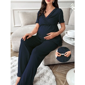Detail of adjustable waist button on navy V-neck maternity loungewear set