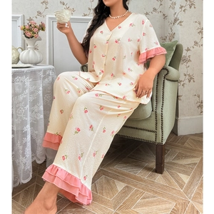 Floral print pajama set with V-neck top and ruffled hem pants in a vintage room setting