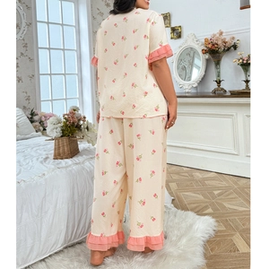 Women's two-piece floral pajama set with pink ruffle hem and loose fitting design