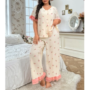 Detail of plus size pajama set with pink tulip print and elegant ruffle hem decoration
