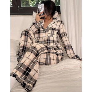 Women's plaid pajama set with button-down long sleeve top and loose pants in beige