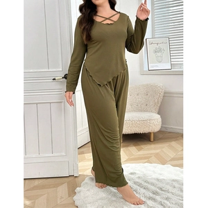Detail of olive green lounge set showing the lettuce edge cuffs and ribbed knit fabric
