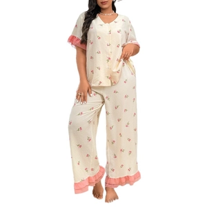 Women's two-piece floral pajama set with tulip print and ruffled pink hem detail