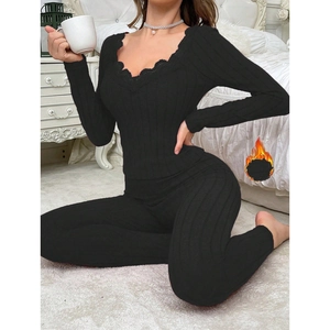 Women's black V-neck thermal pajama set with lace trim and ribbed knit texture