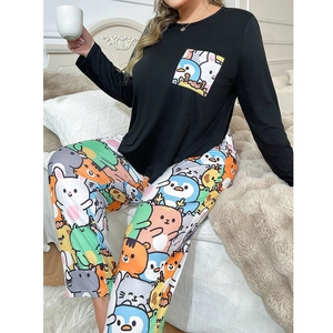 Close-up of women's pajamas featuring cute cartoon animal prints and a chest pocket