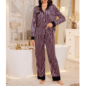 Detail of pink and black vertical striped satin pajamas with contrast collar