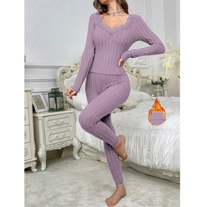 Detail of purple lace V-neck top and ribbed pants with fleece lining for warmth