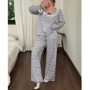 Grey long-sleeve pajama set with lace square neck and black bow prints for women