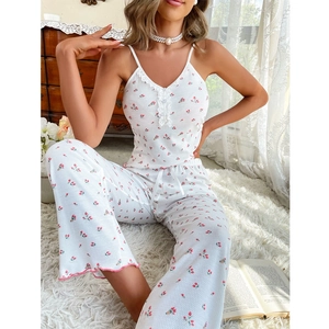 White two-piece floral pajama set with camisole and wide-leg pants in waffle fabric