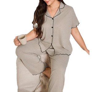 Women's pajama set with short sleeve button-down shirt and loose pants in oatmeal