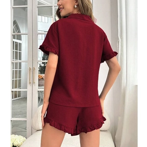 Women's burgundy two-piece pajama set with lapel top, ruffle hem, and comfy shorts