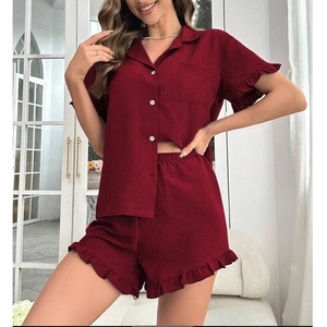 Detail view of burgundy waffle texture pajama set with elegant ruffle trim on shorts