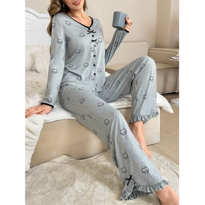 Women's two-piece gray pajama set with cartoon bear print and ruffled cuffs