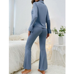 Blue two-piece ribbed pajama set with lapel long sleeve top and flared trousers for women