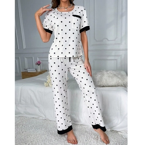 Women's sweet polka dot pajama set with short sleeve top and long pants in white