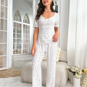 Floral short sleeve pajama set for women with V-neck top and long pants in white